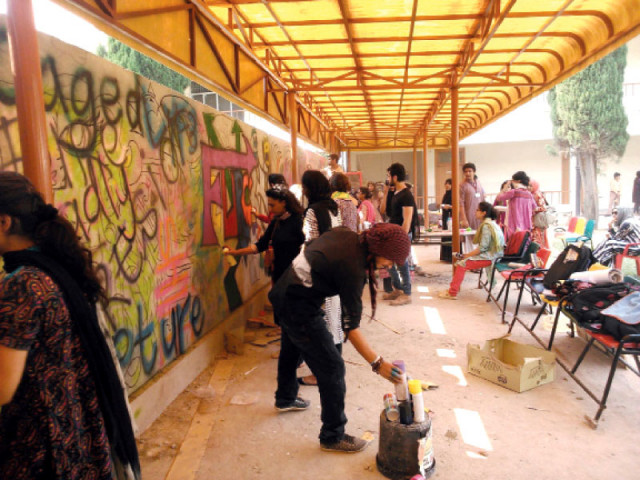 students working on their graffiti projects a finished wall photo express students working on their graffiti projects a finished wall photo express