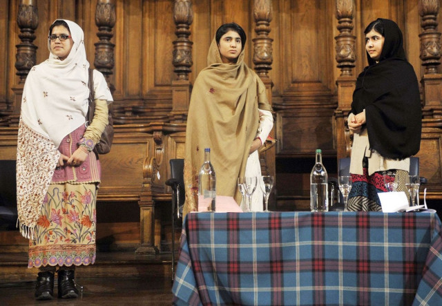 three friends bonded by blood malala yousafzai r stands next to her school friends kainat riaz l and shazia ramzan c during the first global citizenship commission meeting at the university of edinburgh in scotland on october 19 2013 photo afp three friends bonded by blood malala yousafzai r stands next to her school friends kainat riaz l and shazia ramzan c during the first global citizenship commission meeting at the university of edinburgh in scotland on october 19 2013 photo afp