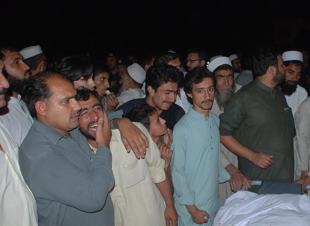 incensed relatives of the slain policemen staged a vociferous protest by placing the bodies on gt road near bala hisar fort photo express iqbal haider