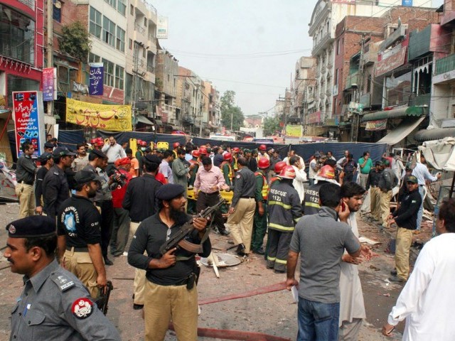 police and rescue officials busy in rescue work after a strong bomb explosion outside a restaurant in the anarkali area in lahore photo ppi