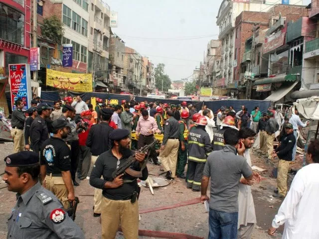 police and rescue officials busy in rescue work after a strong bomb explosion outside a restaurant in the anarkali area in lahore photo ppi police and rescue officials busy in rescue work after a strong bomb explosion outside a restaurant in the anarkali area in lahore photo ppi