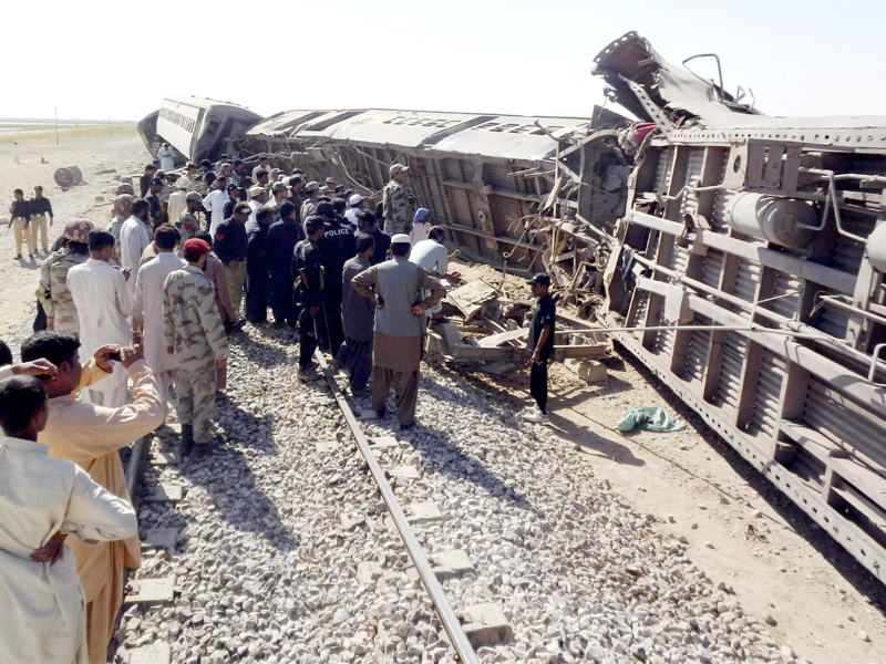 rescuers and security officials gather near the wagons of jaffar express which derailed after a bomb attack in nasirabad photo reuters