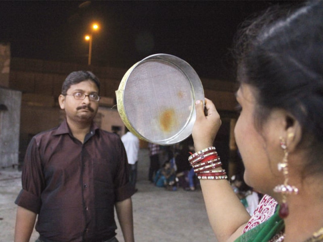 parwa holds the sieve for her husband pardeep on karwa chauth which was celebrated on tuesday evening although pardeep said he does not believe in the tradition his wife insisted on fasting photo ayesha mir express parwa holds the sieve for her husband pardeep on karwa chauth which was celebrated on tuesday evening although pardeep said he does not believe in the tradition his wife insisted on fasting photo ayesha mir express
