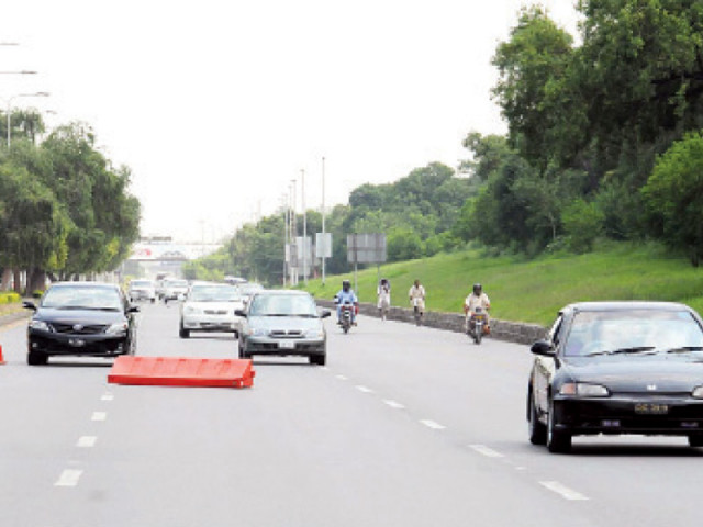 drivers have to face a test as they try to cross a hurdle in the middle of islamabad expressway photo file online drivers have to face a test as they try to cross a hurdle in the middle of islamabad expressway photo file online