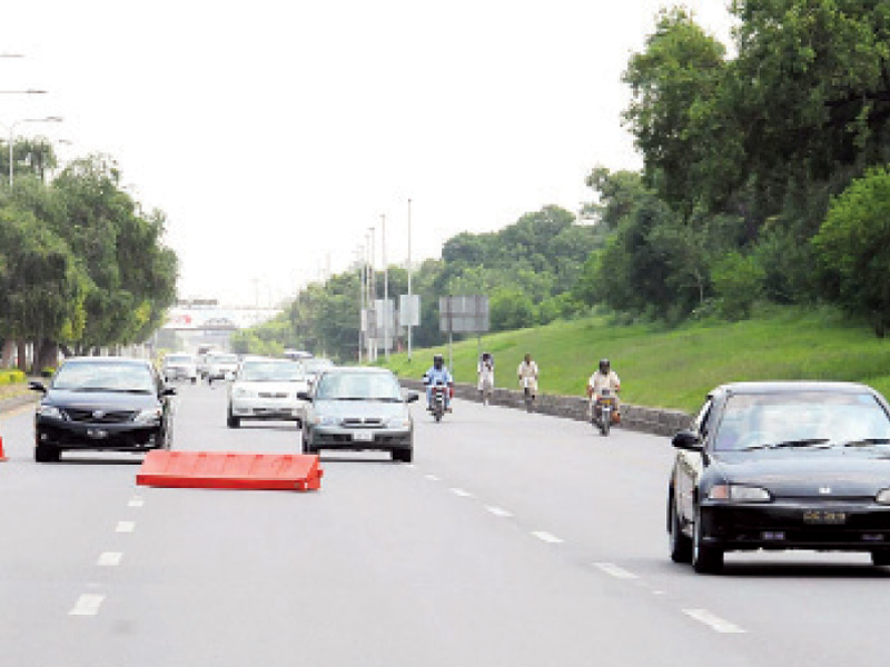 drivers have to face a test as they try to cross a hurdle in the middle of islamabad expressway photo file online