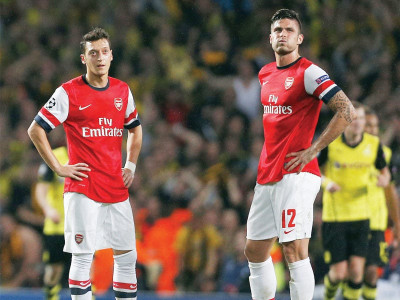 uefa champions league wenger on edge as dortmund burst arsenal bubble