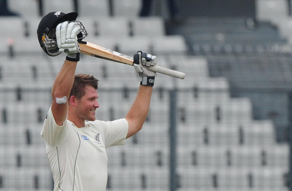 new zealand batsman corey anderson reacts after scoring a century during the third day of the second cricket test match between bangladesh and new zealand at the sher e bangla national stadium in dhaka on october 23 2013 photo afp