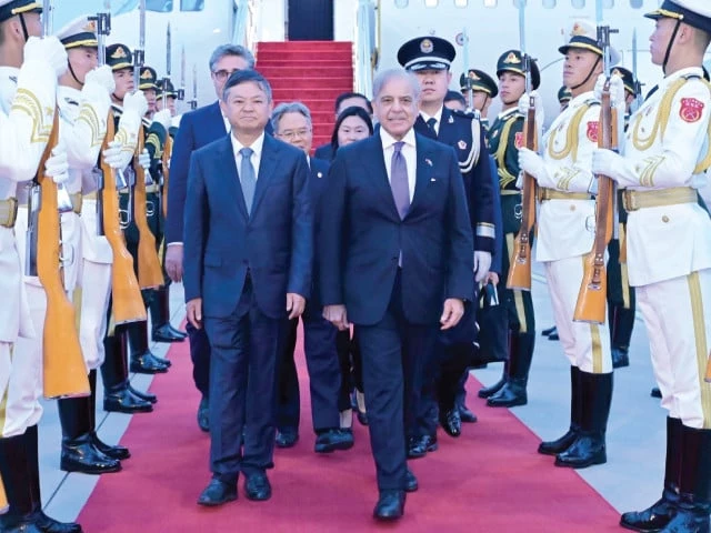 prime minister shehbaz sharif walks with china s environment and ecology minister huang runqiu after arrival at beijing capital international airport photo app prime minister shehbaz sharif walks with china s environment and ecology minister huang runqiu after arrival at beijing capital international airport photo app
