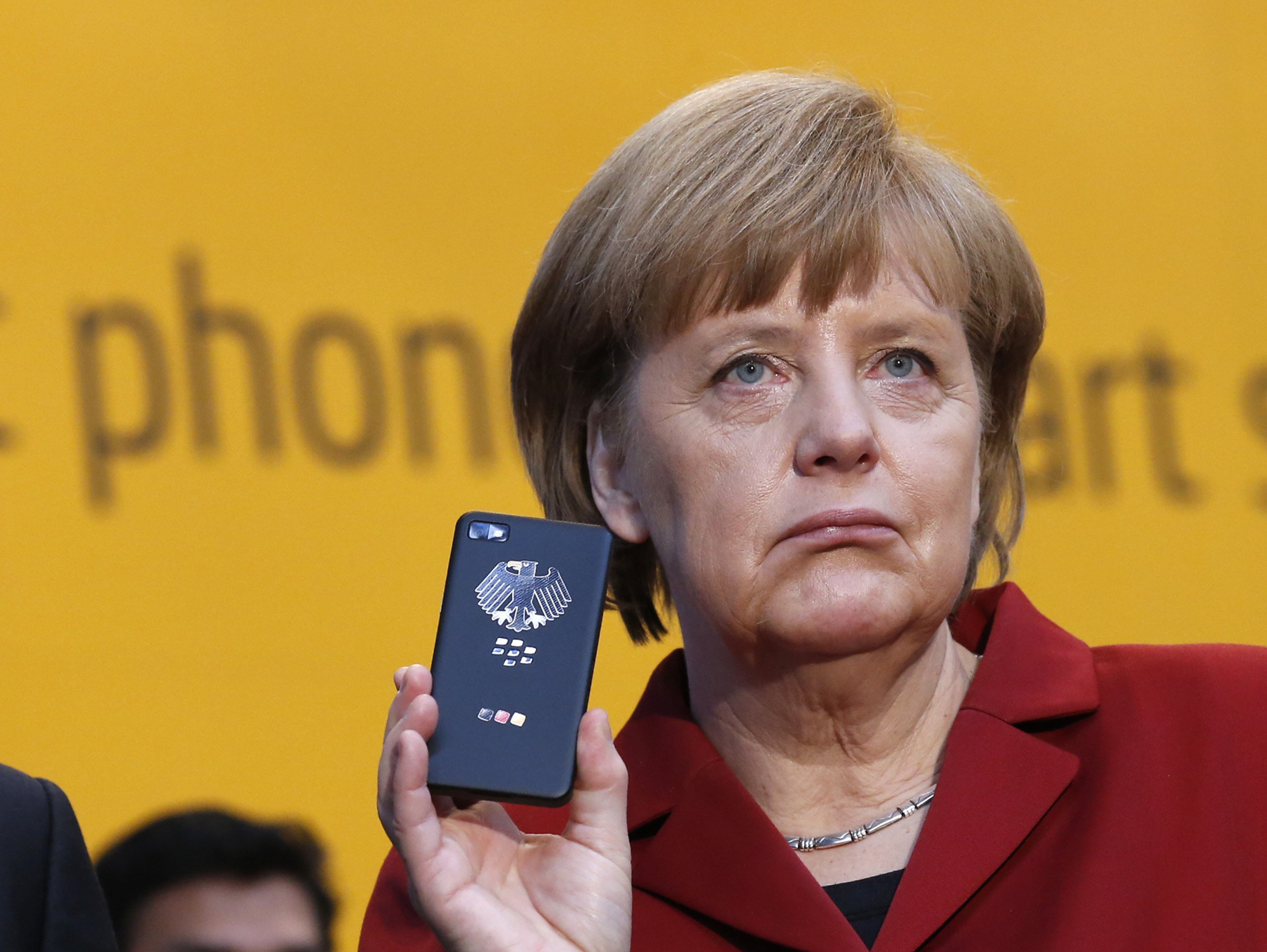 angela merkel r holding a blackberry z10 smartphone featuring high security secusite software used for governmental communication at the booth of secusmart during her opening tour with poland 039 s prime minister donald tusk on the cebit computer fair in hanover in this march 5 2013 file photo photo reuters