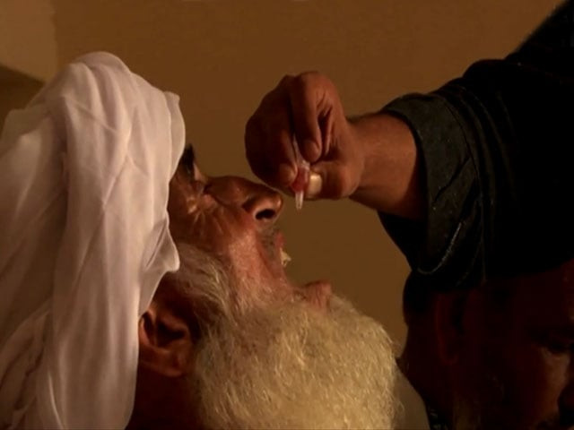 a screengrab of a pashtun man receiving polio drops from the video a screengrab of a pashtun man receiving polio drops from the video
