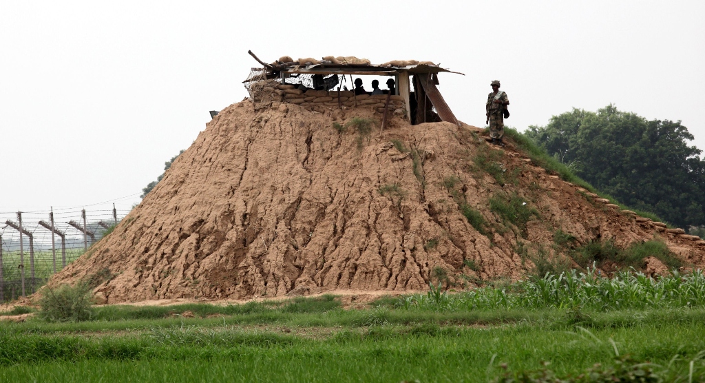 indian border security force bsf soldiers stand guard along fencing near the india pakistan border outpost photo afp file