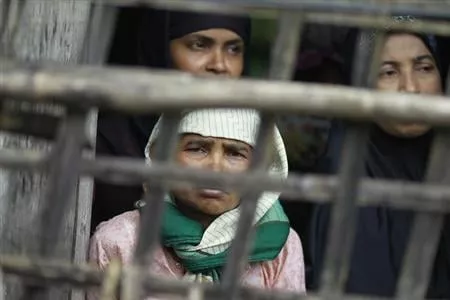 rohingya muslim women look out from their home at aung mingalar quarter in sittwe photo reuters rohingya muslim women look out from their home at aung mingalar quarter in sittwe photo reuters