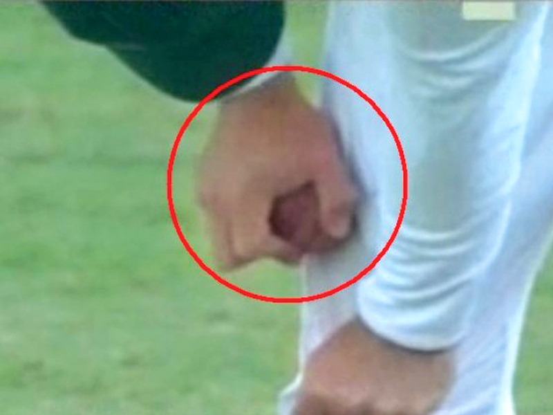 south african fielder faf du plessis rubbing the ball on his trousers close to a zip photo express