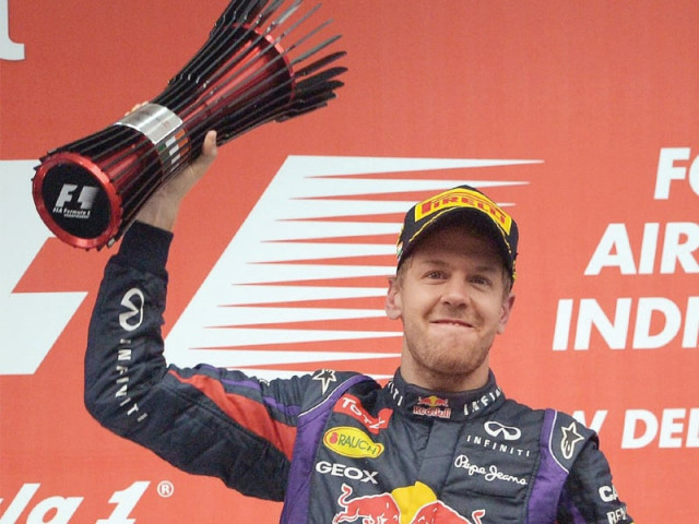 sebastian vettel shattered history books as he sealed his fourth consecutive title after winning the indian gp yesterday photo afp sebastian vettel shattered history books as he sealed his fourth consecutive title after winning the indian gp yesterday photo afp