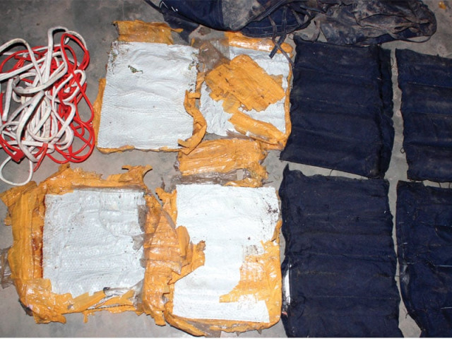 police unearthed two suicide vests buried in wazir colony after locals reported suspicious activity saturday night photo muhammad iqbal express police unearthed two suicide vests buried in wazir colony after locals reported suspicious activity saturday night photo muhammad iqbal express
