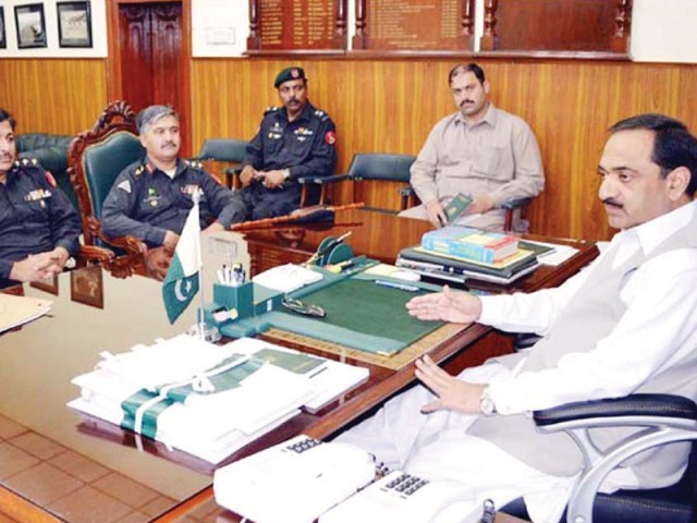 commissioner sahibzada anis r attending a meeting in peshawar in this may 2013 photo photo nni file