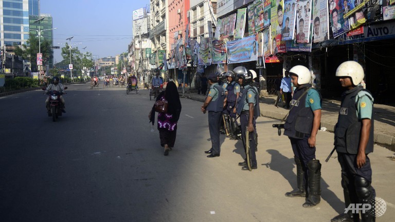 bangladeshi police personnel stand guard during the second day of a nationwide strike called by the opposition bnp in dhaka photo afp