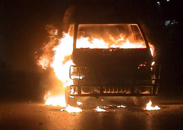 a mini truck and a bus were put on fire in kotri photo express a mini truck and a bus were put on fire in kotri photo express