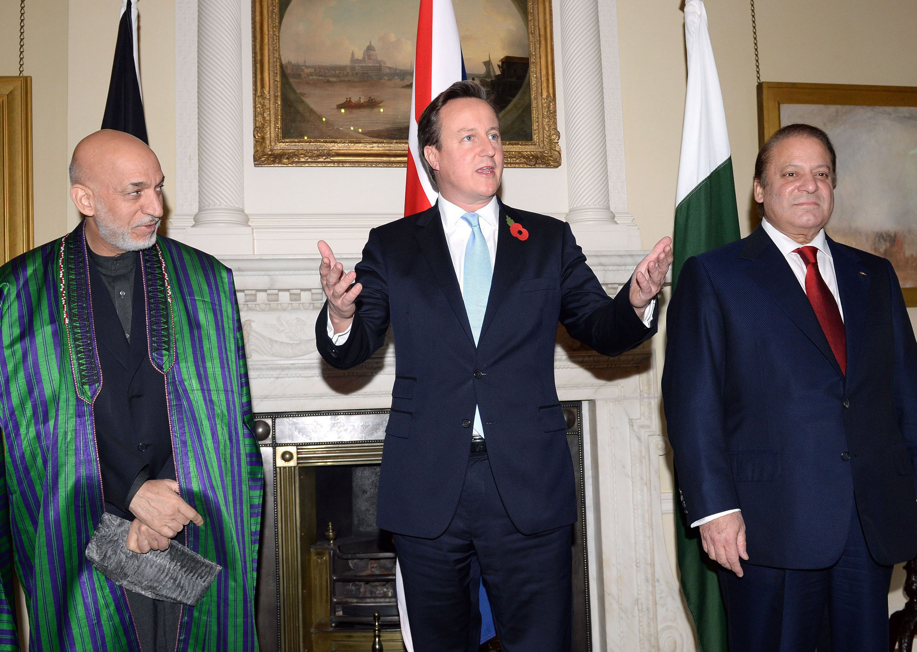 british prime minister david cameron c afghan president hamid karzai l and pakistani premier nawaz sharif r pose for a picture ahead of a trilateral meeting in downing street in london on october 29 2013 photo afp