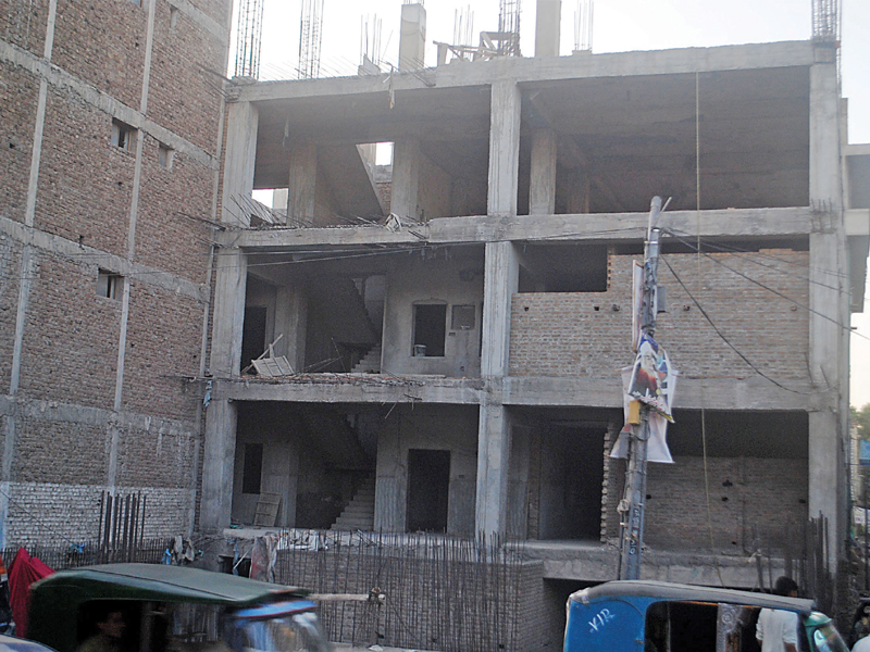 the labour department is devising a plan to evacuate these flats from the illegal occupants photo muhammad iqbal express file