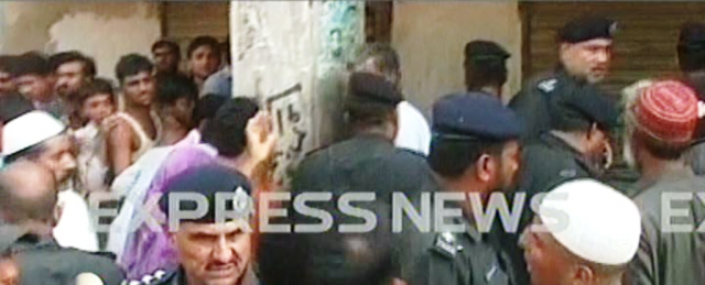 screengrab of the police and onlookers gathered outside the shop the thief took refuge in