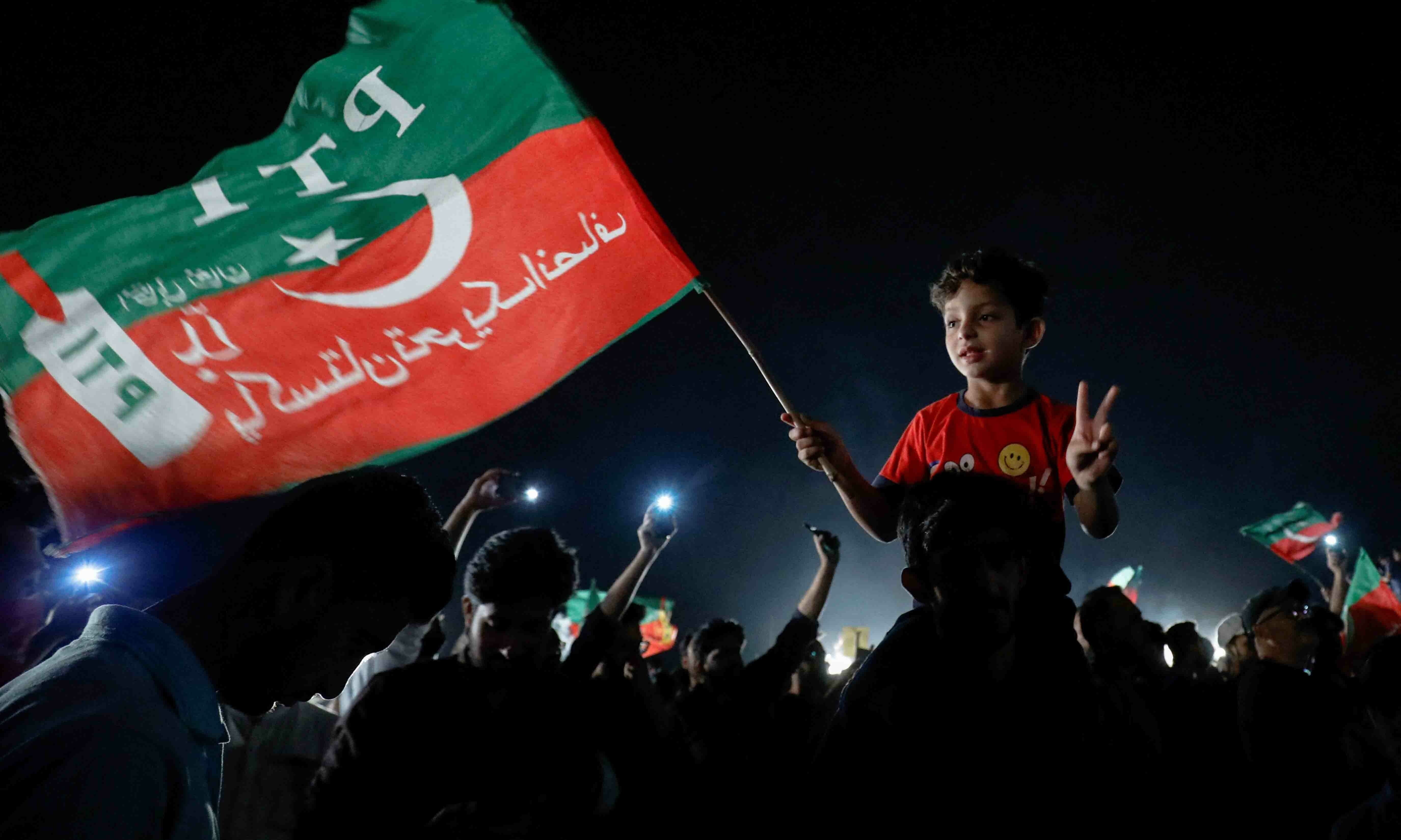 a child waves a pti flag and gestures during a rally in support of former prime minister imran khan in islamabad on april 10 reuters