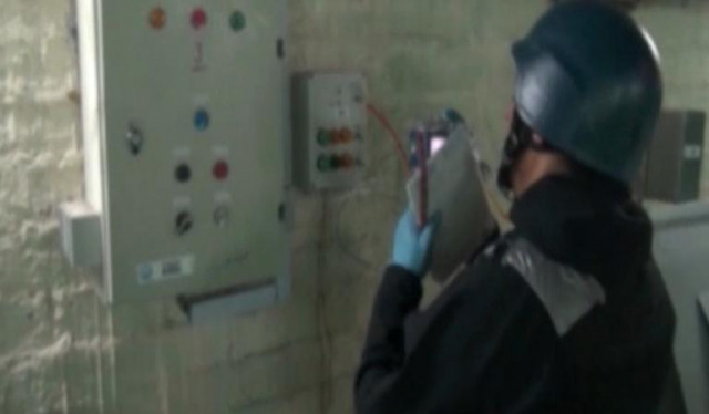 an image taken from syrian television shows an inspector from the opcw at work at an undisclosed location in syria on october 8 2013 photo afp an image taken from syrian television shows an inspector from the opcw at work at an undisclosed location in syria on october 8 2013 photo afp