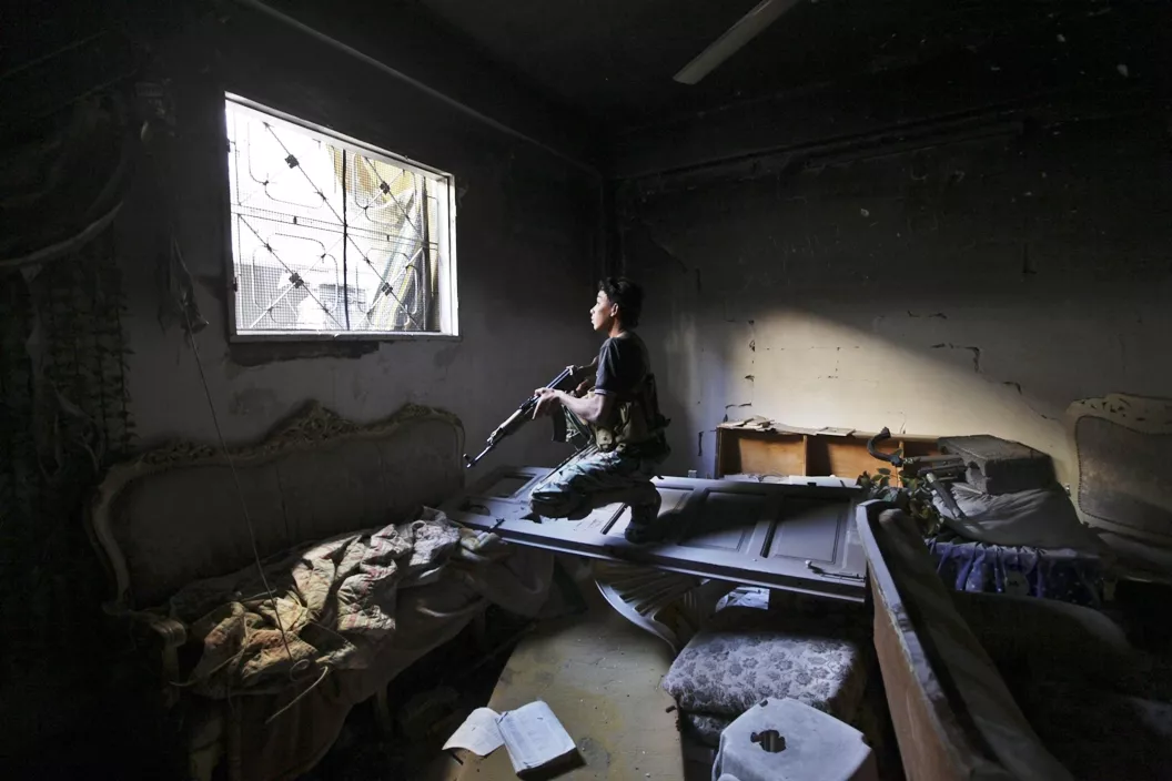 file photo of a free syrian army fighter carries his weapon in a damaged building in eastern syria photo reuters file photo of a free syrian army fighter carries his weapon in a damaged building in eastern syria photo reuters