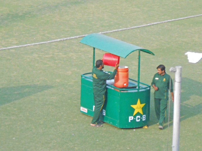 cricket has been modernised all around the world with automatic water trolley cars being used for drinks but at the headquarters of the pakistan cricket board pcb in lahore groundsmen pour water from a bucket into the cooler photo express