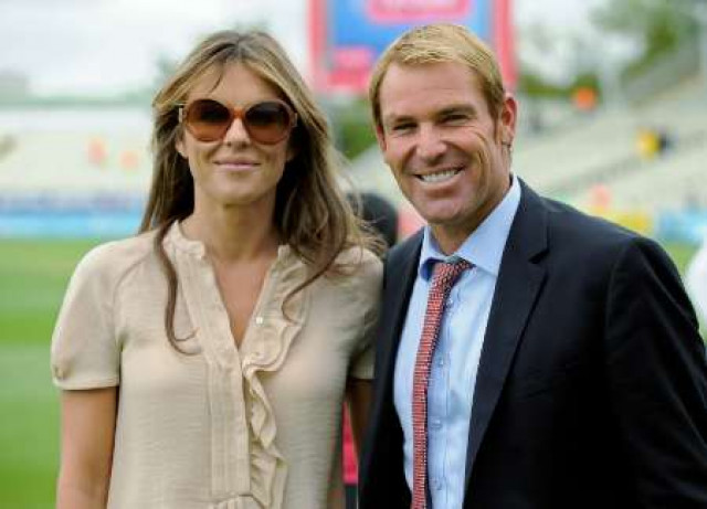shane warne and his girlfriend elizabeth hurley pose for a photograph on the field after england defeated india in the third cricket test match at edgbaston cricket ground in birmingham photo reuters shane warne and his girlfriend elizabeth hurley pose for a photograph on the field after england defeated india in the third cricket test match at edgbaston cricket ground in birmingham photo reuters