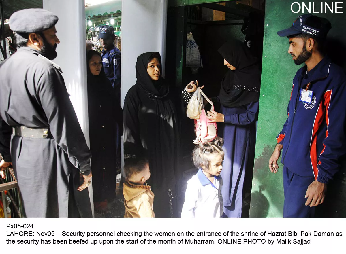 security personnel screen devotees arriving at the hazrat bibi pak daman shrine in lahore on tuesday as security is beefed for muharram photo online security personnel screen devotees arriving at the hazrat bibi pak daman shrine in lahore on tuesday as security is beefed for muharram photo online