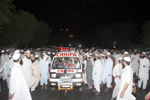 seminary students from jamia binoria gather around the ambulance carrying fellow seminary students attacked near ma jinnah road on tuesday evening photo mohammad noman express