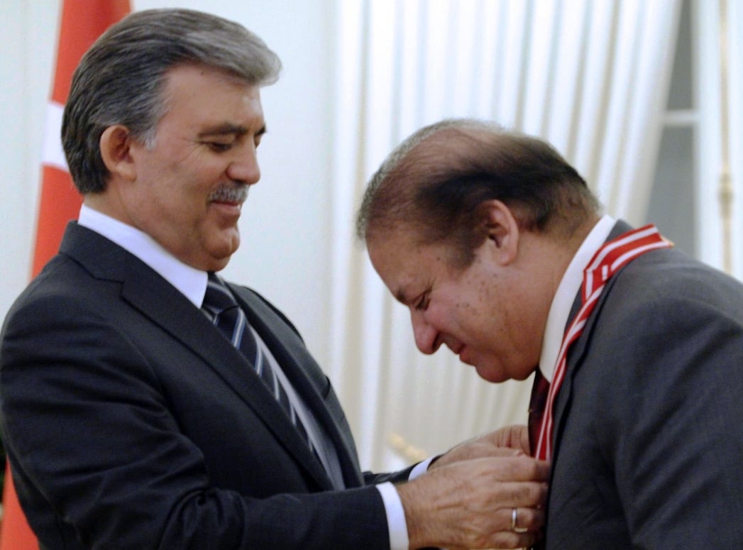 turkish president abdullah gul awards prime minister nawaz sharif with turkey 039 s order of the republic during a ceremony in ankara on september 17 2013 photo afp