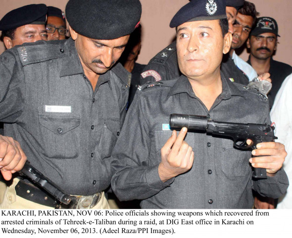 police display silenced weapons recovered from tehreek e taliban suspects arrested from karachi on wednesday photo ppi police display silenced weapons recovered from tehreek e taliban suspects arrested from karachi on wednesday photo ppi