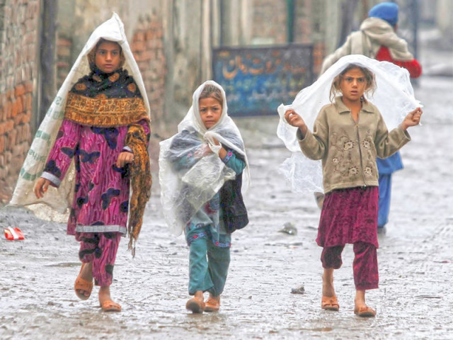 girls cover themselves with plastic sheets as they walk in the rain through the city photo reuters girls cover themselves with plastic sheets as they walk in the rain through the city photo reuters