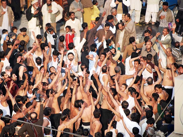 an old image of mourners observe self flagellation during a procession on 8th of muharram in attock photo online