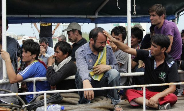 file photo of asylum seekers from afghanistan iraq and iran crying as indonesian officers force them to leave the australian vessel hermia photo reuters file photo of asylum seekers from afghanistan iraq and iran crying as indonesian officers force them to leave the australian vessel hermia photo reuters
