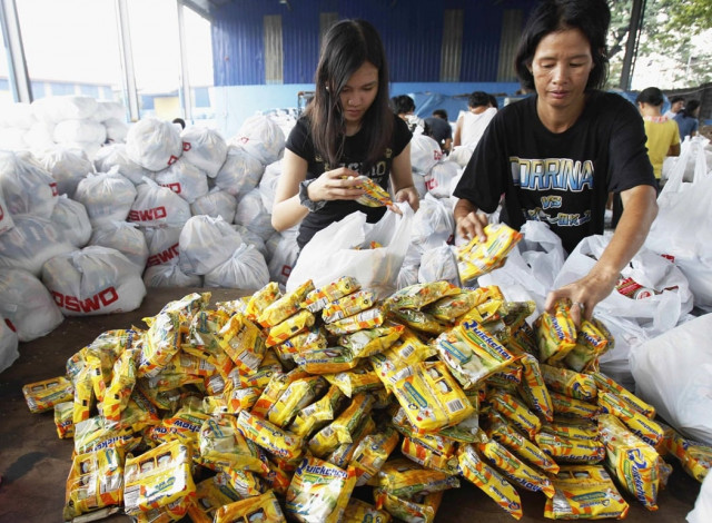 volunteers pack relief goods inside a department of social welfare and development warehouse before shipping out to devastated provinces hit by typhoon haiyan in manila november 8 2013 photo reuters volunteers pack relief goods inside a department of social welfare and development warehouse before shipping out to devastated provinces hit by typhoon haiyan in manila november 8 2013 photo reuters