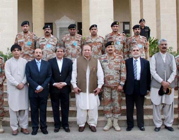 prime minister nawaz sharif with chief minister sindh qaim ali shah governor sind ishratul ibad khan interior minister chaudry nisar ali khan and dg rangers at the rangers headquarter in karachi photo pid