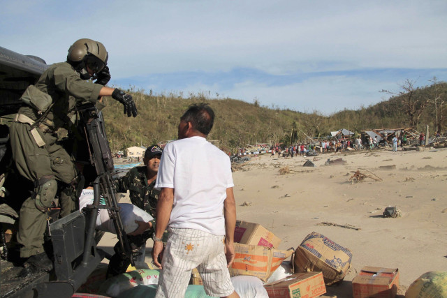 the philippine air force unload relief goods to the isolated residents of a village photo reuters the philippine air force unload relief goods to the isolated residents of a village photo reuters