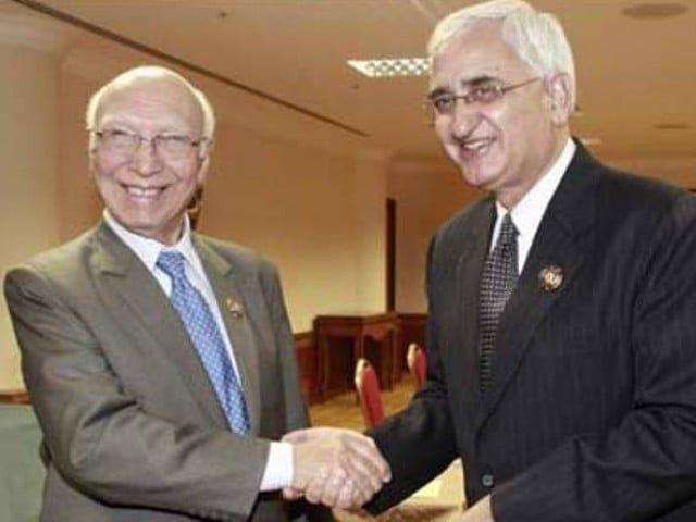 indian external affairs minister salman khurshid r and advisor to prime minister on national security sartaj aziz l photo radio pakistan