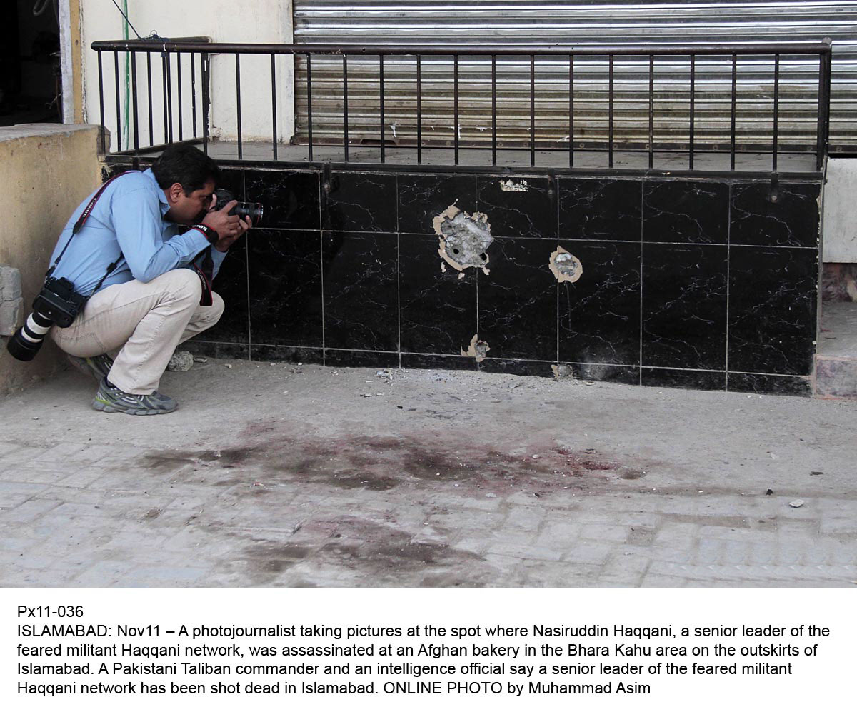 a photojournalist taking picture at the place where nasiruddin haqqani qas assassinated photo onlie