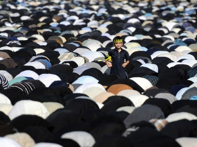 a boy stands amongst worshippers as they offer noon prayers during a religious procession on the ninth day of holy month of moharram in karachi on november 24 2012 photo afp file a boy stands amongst worshippers as they offer noon prayers during a religious procession on the ninth day of holy month of moharram in karachi on november 24 2012 photo afp file