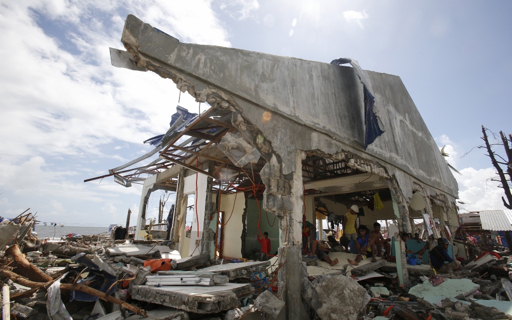 survivors stay inside a battered house damaged by super typhoon haiyan in tanauan leyte in central philippines november 14 2013 photo reuters