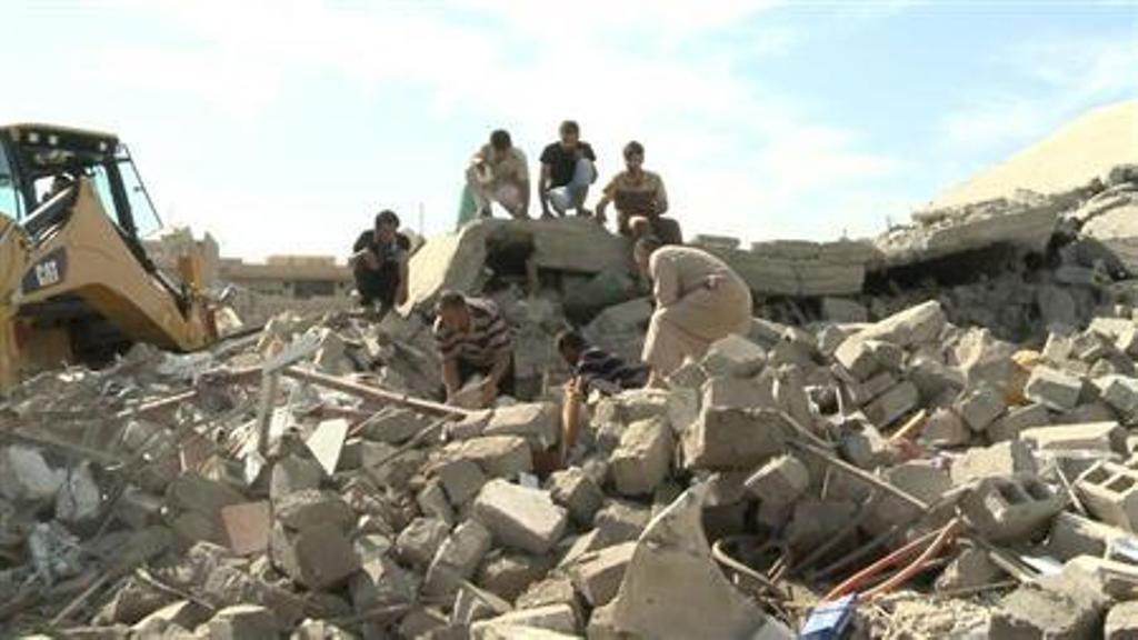 civilians gather at the site of a bomb attack in the village of mwafaqiya in nineveh province october 17 2013 photo reuters