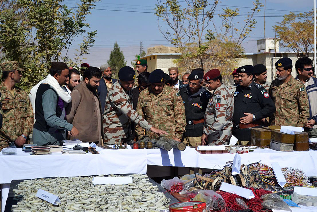 fc commander lt general nasir khan observes the weapons seized during the raid photo online