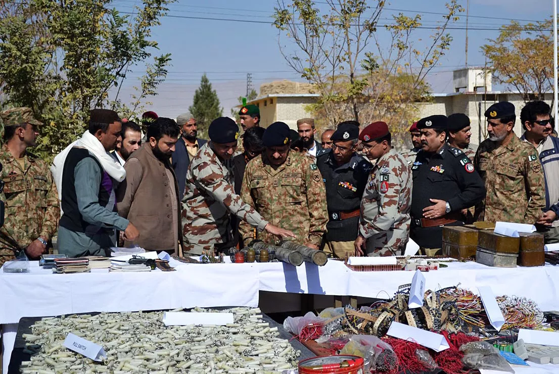 fc commander lt general nasir khan observes the weapons seized during the raid photo online fc commander lt general nasir khan observes the weapons seized during the raid photo online