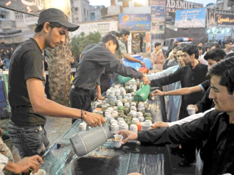 a man pours tea at a sabeel set up for mourners during muharram last year a lot of sunnis set up these stalls for their shia brothers photo file
