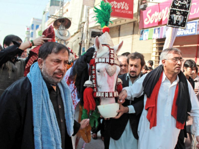 a muharram procession that left hussainia imambargah passes through saddar road in peshawar photo muhammad iqbal express a muharram procession that left hussainia imambargah passes through saddar road in peshawar photo muhammad iqbal express