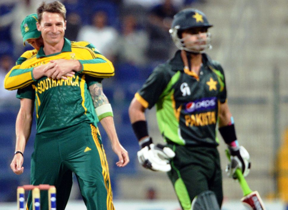 south african bowler dale steyn l celebrates with team mate after taking a wicket of pakistani opener ahmad shehzad r during the third day night international in sheikh zayed cricket stadium in abu dhabi on novemver 6 2013 photo afp